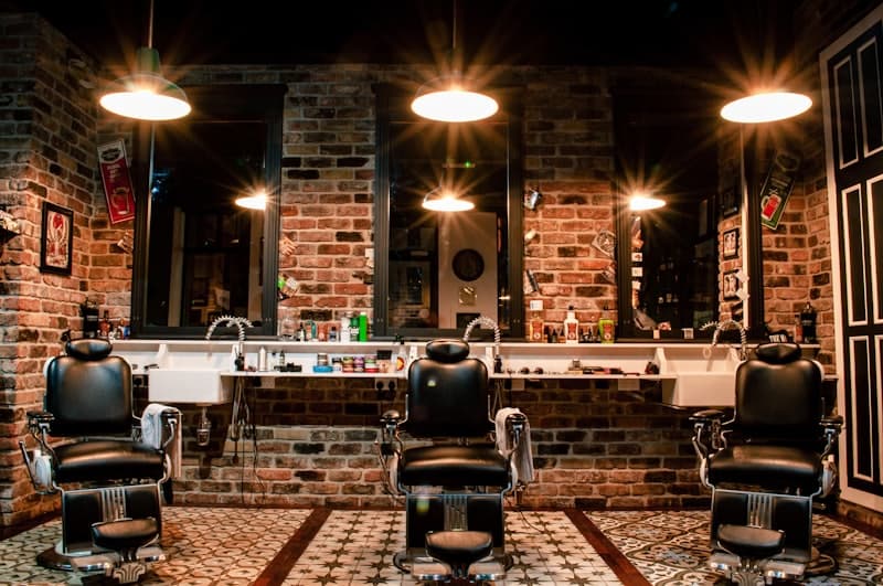 A modern barbershop interior with vintage chairs