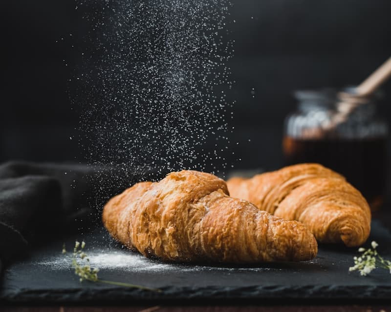 Fresh croissants dusted with sugar